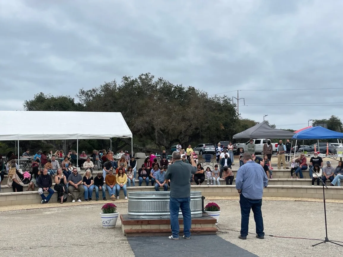 An outdoor baptism service at Hope Chapel