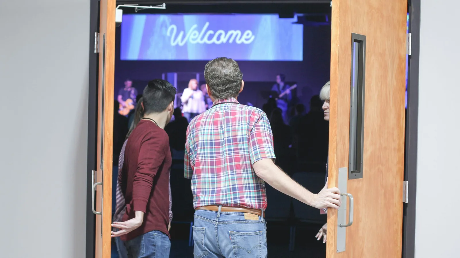 People walking into the sanctuary